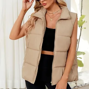 Close-up of a women's khaki padded puffer vest with stand collar and zipper detail.
