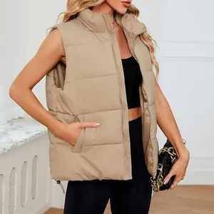 Close-up detail of a khaki women's sleeveless puffer vest featuring a stand collar.