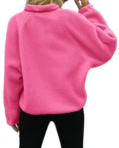 Back view detail of a cozy bright pink fleece jacket with high collar for women