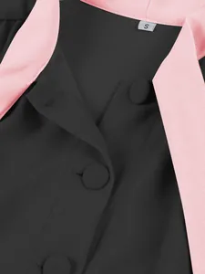 Close-up detail of the pink lapel collar and buttons on a black elegant swing dress