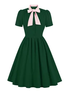 Elegant dark green vintage flare dress with pink bow-tie collar detail