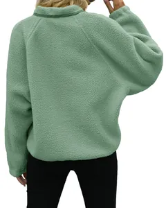 Detailed back view of a soft sage green sherpa fleece jacket for casual autumn wear