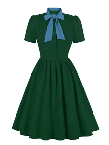 Vintage dark green flared dress with elegant blue bow-tie collar and short sleeves
