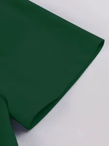 Macro view of short sleeve stitching and fabric texture on a dark green elegant dress