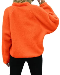 Vibrant orange sherpa fleece jacket for women shown from behind, perfect for winter wear