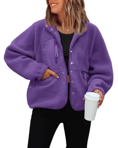 Cozy purple fleece jacket for women with zipper pockets and button details