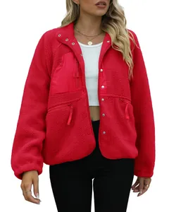 Detailed view of women's red teddy fleece jacket with buttons and functional pockets