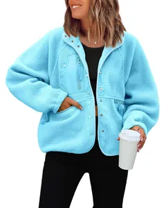 Detail of women's cozy sky blue fuzzy sherpa fleece jacket with functional zipper pockets