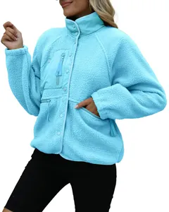 Detail view of the soft light blue women's fleece jacket with functional chest pocket