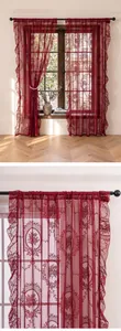 Close-up of red French rural lace sheer curtain with elegant floral mirror pattern