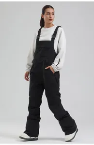 Full body view of professional women's black insulated ski bib pants in studio