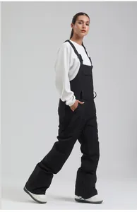 Professional waterproof black women's ski bib pants for snowboarding and winter sports.