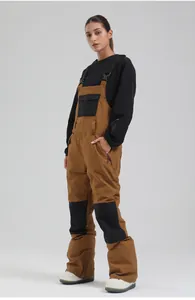 Professional women's brown ski bib pants featuring windproof and waterproof fabric