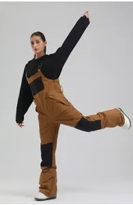 Professional women's ski bib pants featuring brown and black waterproof durable fabric