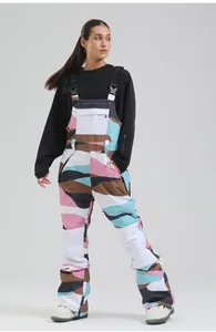 Full-body view of women's camouflage ski bib overalls with multi-color pattern design