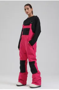 Women's professional pink and black waterproof ski bib pants for winter snow sports