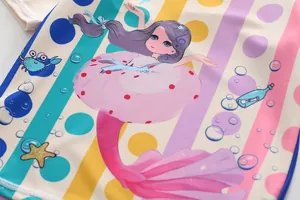 Detailed macro view of colorful mermaid print on UV-protective girl's swimsuit
