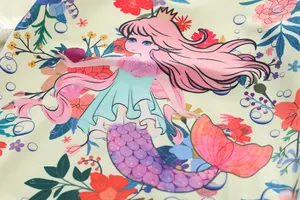 Macro view of mermaid and floral print on girls' UV protection swimsuit detail