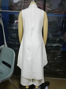 Back view of white sleeveless high collar jumpsuit with irregular hem on mannequin.