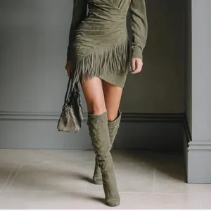 Western cowboy style green suede long sleeve mini dress with fringe detailing