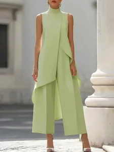 Elegant light green high-neck sleeveless jumpsuit with a unique irregular layered design