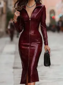 Detailed texture of burgundy crocodile pattern midi dress with front zipper.