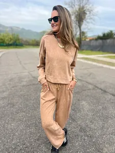 Women's casual washed tan two-piece sweatshirt and jogger set with drawstring waist.