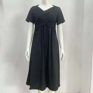 Detail showing the elegant criss-cross bodice design of this black summer midi dress