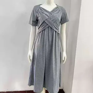 Close-up view of a grey short sleeve dress featuring a stylish crossover bust design.