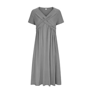 Front view of grey summer short sleeve dress with unique cross pleated bust design