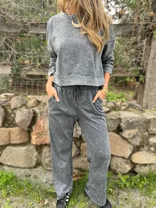 Casual women's acid-wash grey sweatshirt and matching drawstring joggers loungewear set
