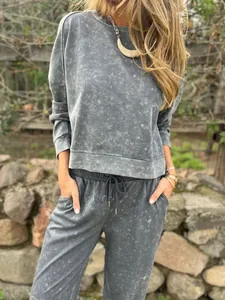 Close-up of women's casual washed grey tracksuit set with crew neck and drawstring