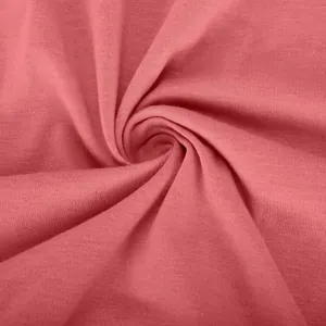 Detailed macro view of high-quality soft pink knit fabric texture for summer dress
