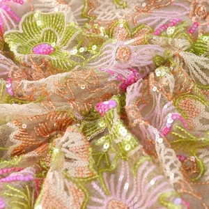 Exquisite close-up detail of floral embroidery and shimmering sequins on mesh fabric