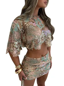 Detail view of the intricate floral sequin embroidery on this crop top and skirt set.