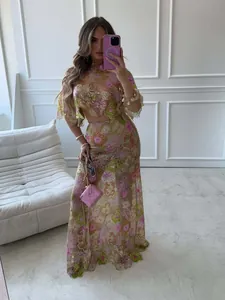 Elegant floral embroidered sequin two-piece set featuring a crop top and matching long skirt.