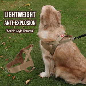 Detail view of a khaki saddle dog harness on a Golden Retriever outdoors on grass.