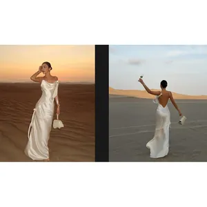 Elegantes weißes Satin-Maxikleid mit Wasserfall-Ausschnitt in einer Wüstenlandschaft