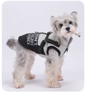 Detailed view of a waterproof warm dog coat with reflective harness and slogan print