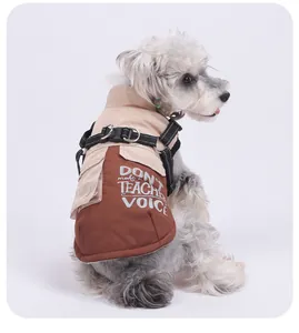 Detailed view of brown and tan dog winter coat with integrated reflective harness