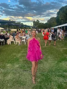 Elegant fuchsia tiered ruffle halter backless mini dress perfect for summer resort parties