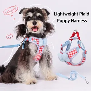 Red and white plaid dog harness and leash set with a cute blue bow decoration