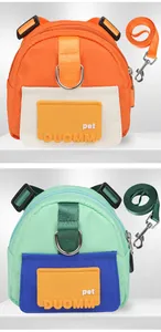 Detail view of colorful cartoon pet backpacks with matching leashes and durable metal clips