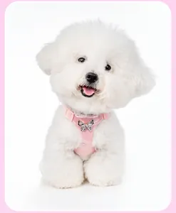 Refined pink dog harness for small breeds featuring a sparkling metal butterfly bow detail