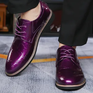 Detailed view of men's purple lace-up patent leather dress shoes with crinkle texture