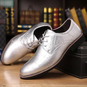 Detail view of men silver dress shoes with unique crinkled metallic texture finish