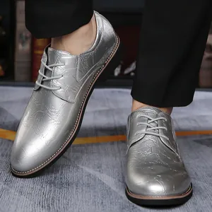 Close-up of silver textured pointed-toe lace-up oxford shoes for business and weddings