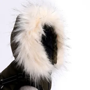 Warm winter dog puffer jacket featuring a large white faux fur hood for wind protection