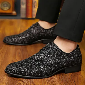 Detailed macro view of black men's glitter dress shoes perfect for parties or weddings