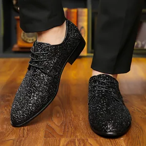 Close-up of men's sparkling black glitter lace-up dress shoes for parties or dancing